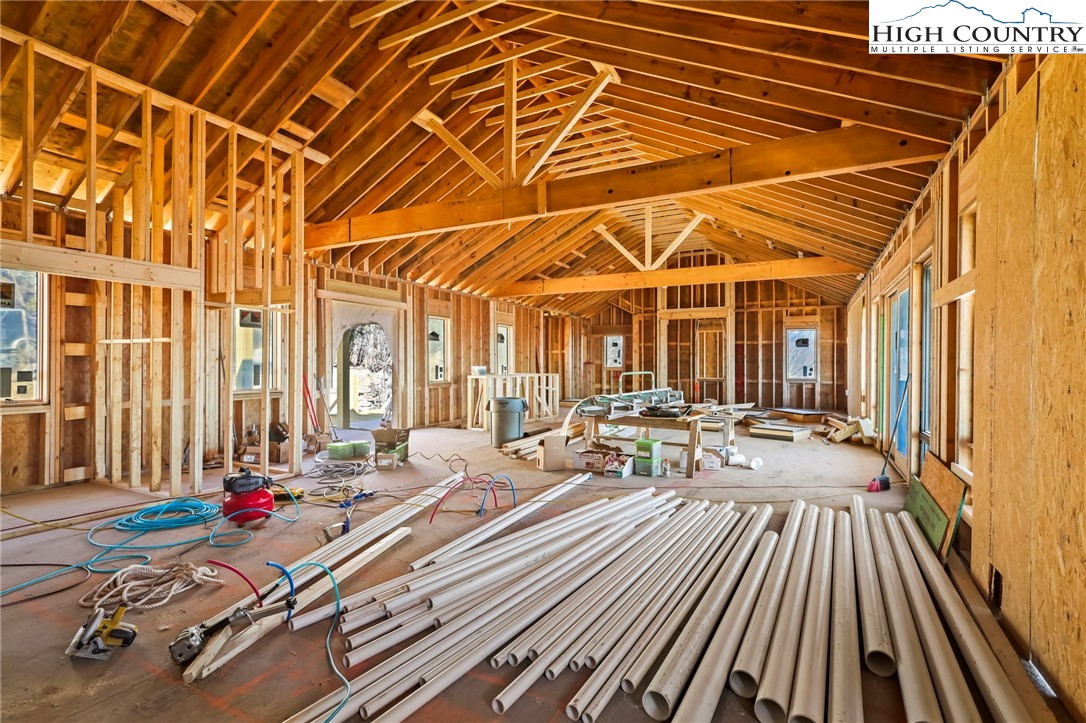 29 Fox Run Road Banner Elk, NC 28604 - Photo 19 of 47 a view of a patio with table and chairs and wooden floor
