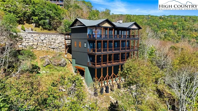 a view of a brick house with large windows