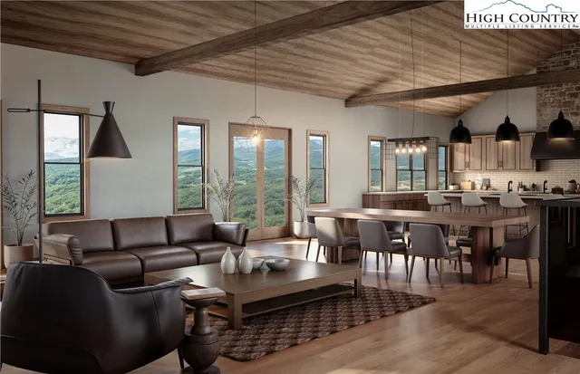 a living room with furniture a wooden floor and window