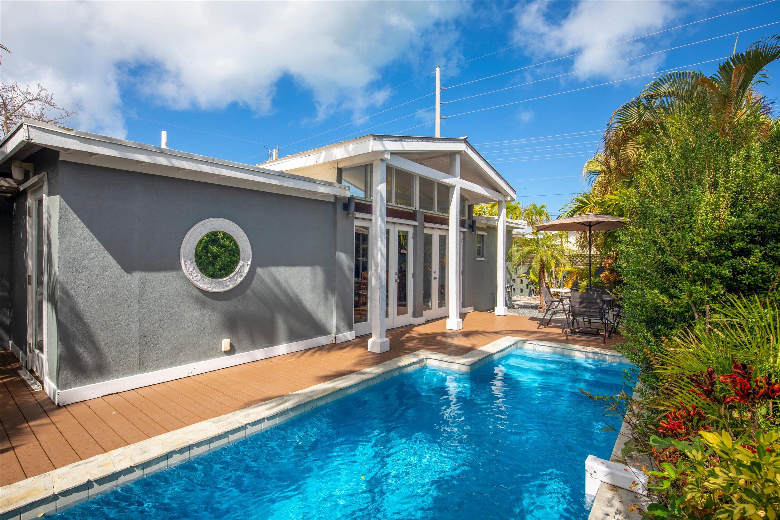 1507 19th Street Key West, FL 33040 - Photo 1 of 73 a backyard of a house with table and chairs