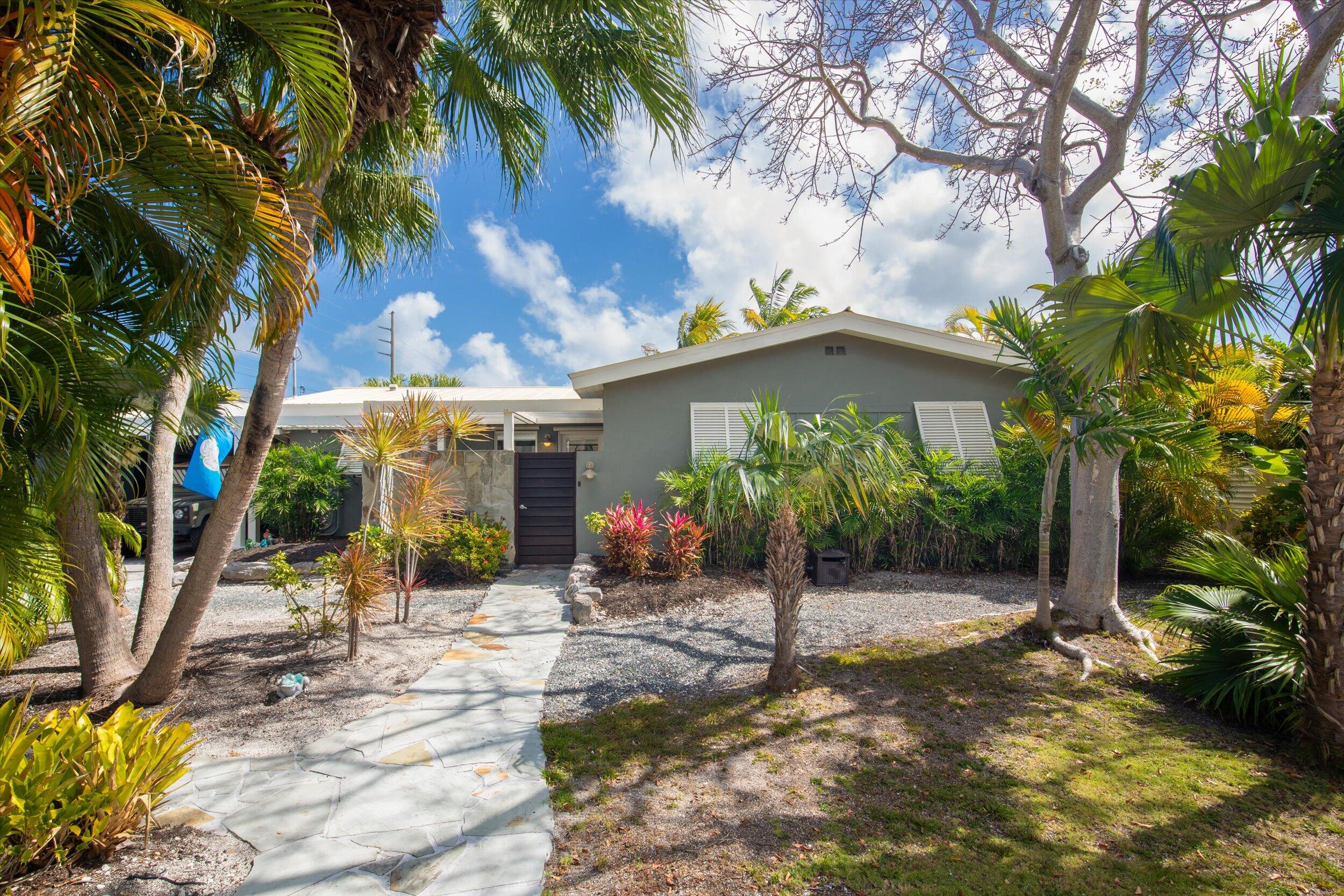 1507 19th Street Key West, FL 33040 - Photo 12 of 73 a view of a house with a tree in front of it