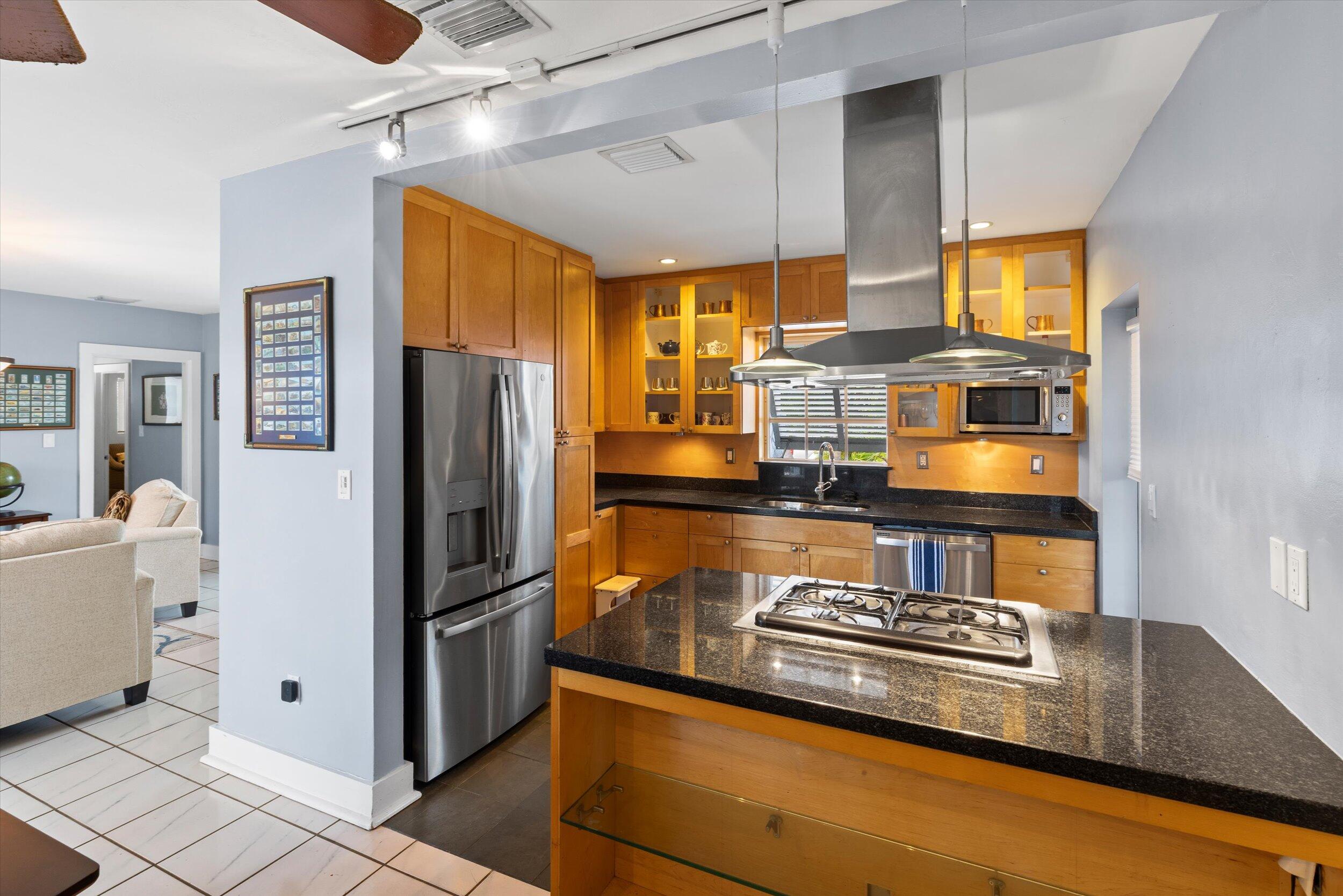 1507 19th Street Key West, FL 33040 - Photo 18 of 73 a kitchen with stainless steel appliances granite countertop a refrigerator a stove and a sink with granite countertops