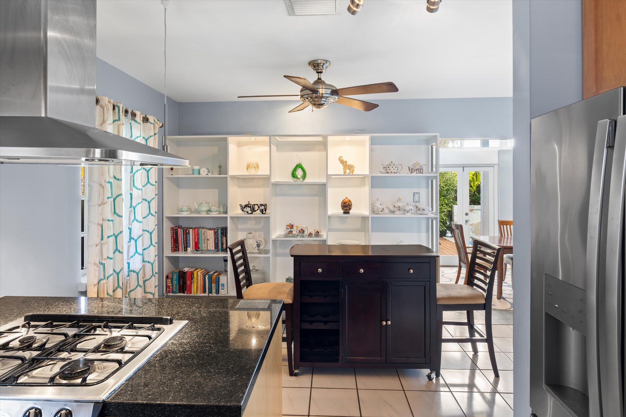 1507 19th Street Key West, FL 33040 - Photo 20 of 73 a kitchen with stainless steel appliances granite countertop a refrigerator and a stove top oven