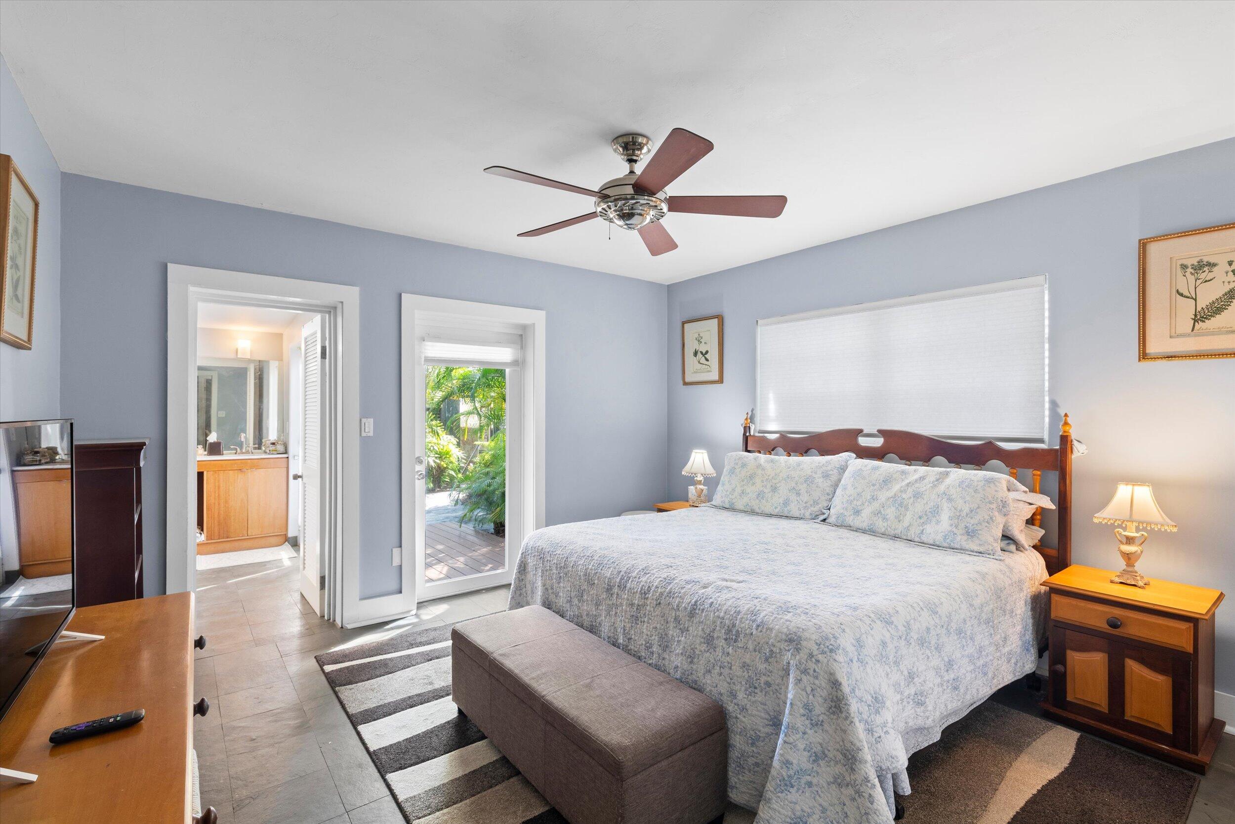 1507 19th Street Key West, FL 33040 - Photo 23 of 73 a bedroom with a large bed couch and a window