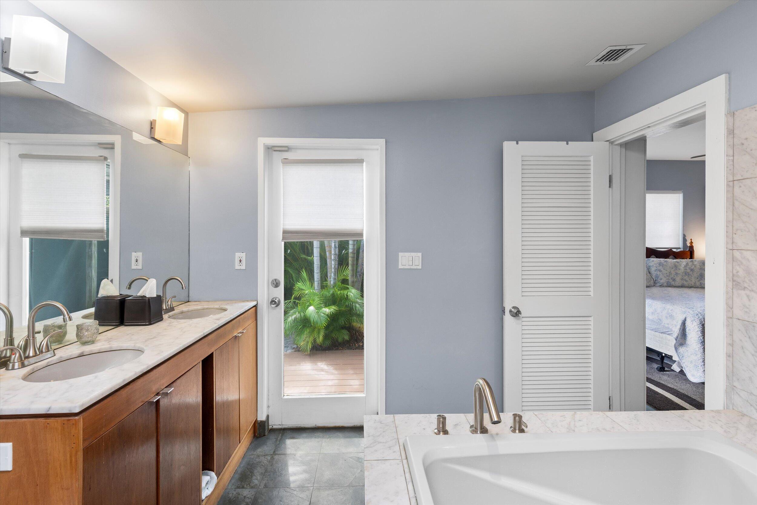 1507 19th Street Key West, FL 33040 - Photo 28 of 73 a bathroom with a double vanity sink and a mirror