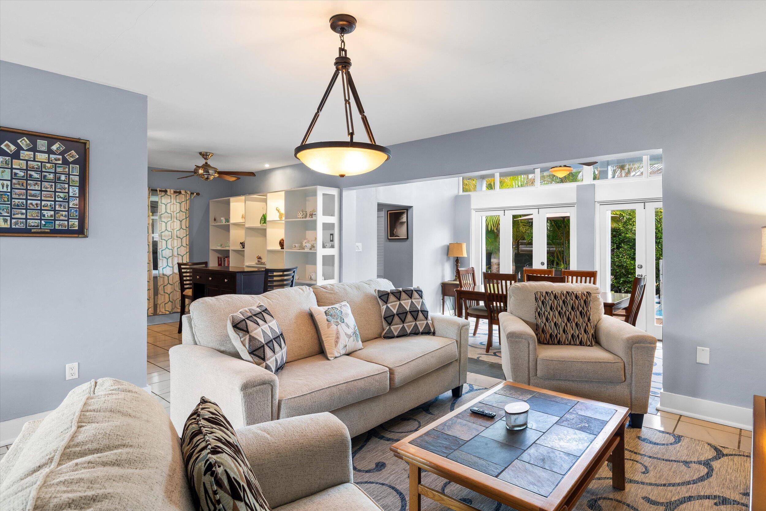 1507 19th Street Key West, FL 33040 - Photo 56 of 73 a living room with furniture a table and a chandelier