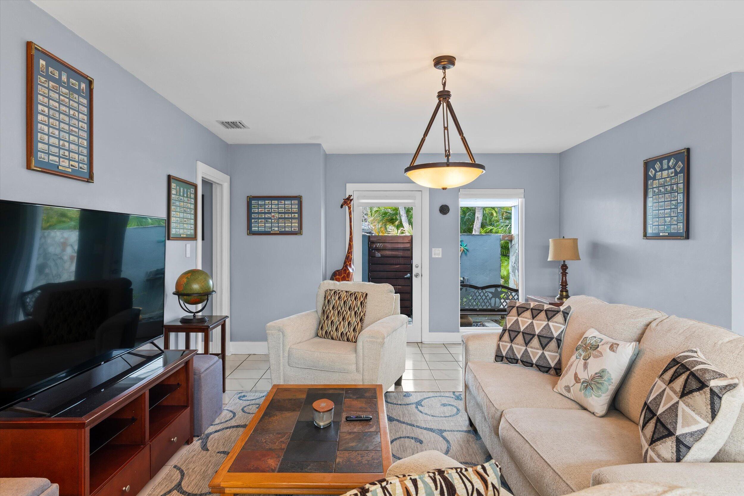 1507 19th Street Key West, FL 33040 - Photo 60 of 73 a living room with furniture a flat screen tv and a window