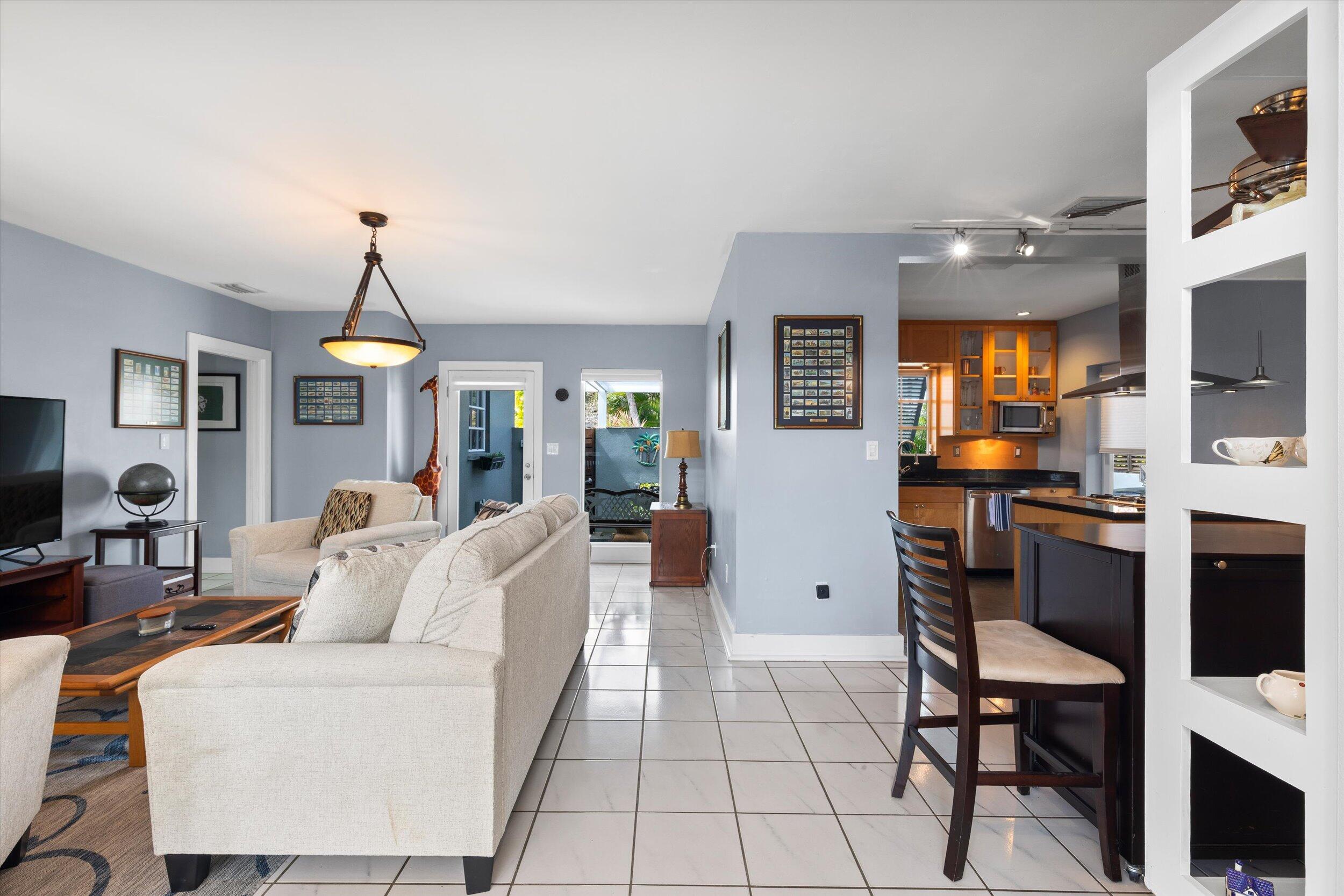 1507 19th Street Key West, FL 33040 - Photo 68 of 73 a living room with furniture a flat screen tv and kitchen view