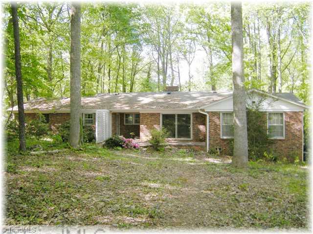8307 Maloe Court Oak Ridge, NC 27310 - Photo 2 of 8 Exterior Back.