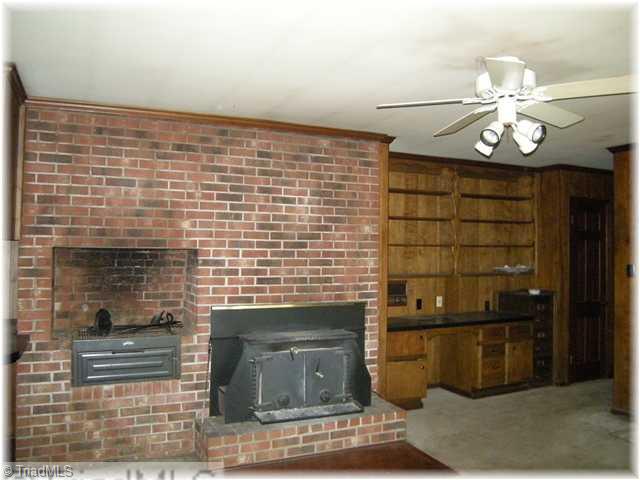 8307 Maloe Court Oak Ridge, NC 27310 - Photo 5 of 8 Den/Family/Great Room. Den with Fireplace and built-in grill