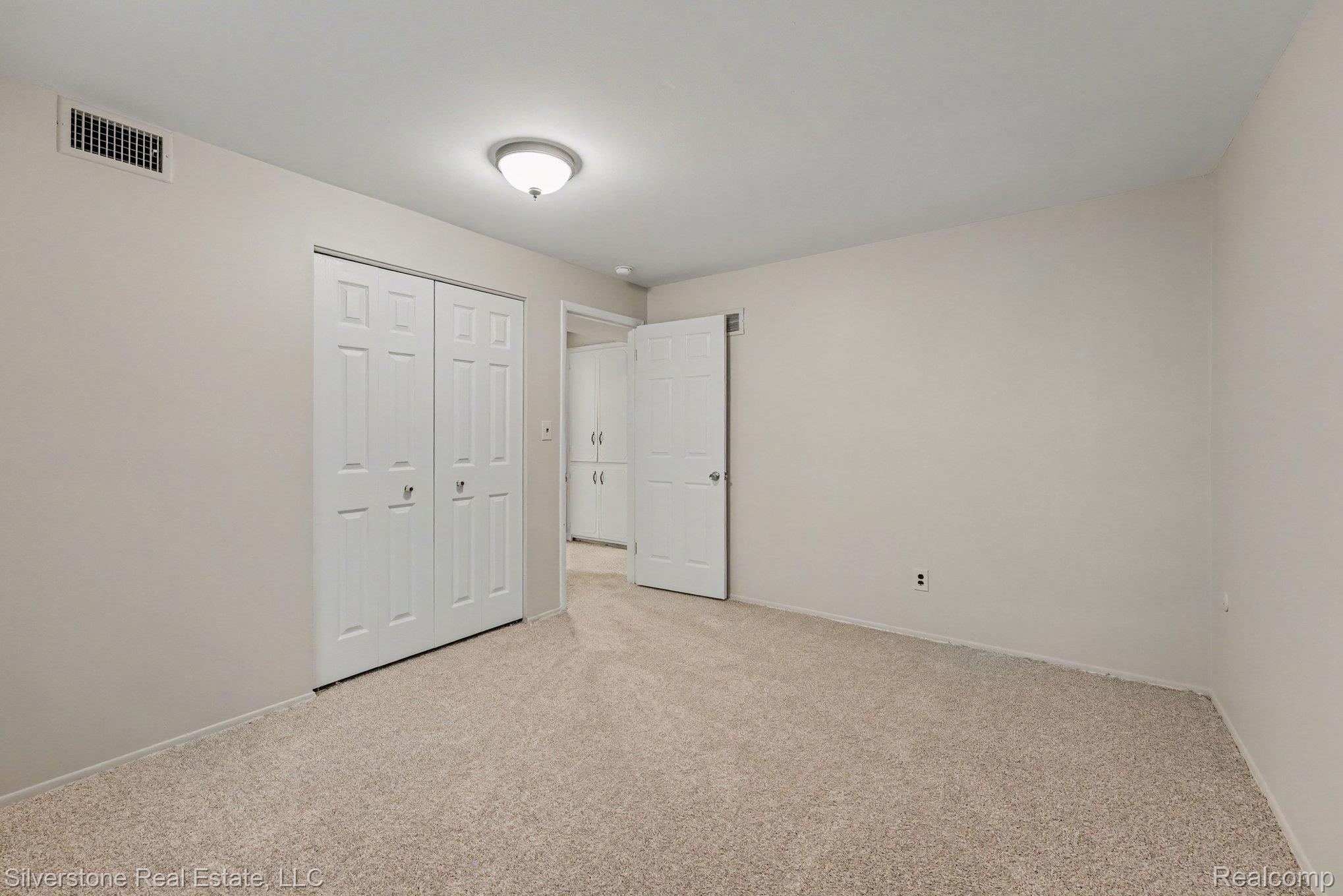 547 Reed Street Northville, MI 48167 - Photo 24 of 38 Carpeted interior room with neutral-toned walls