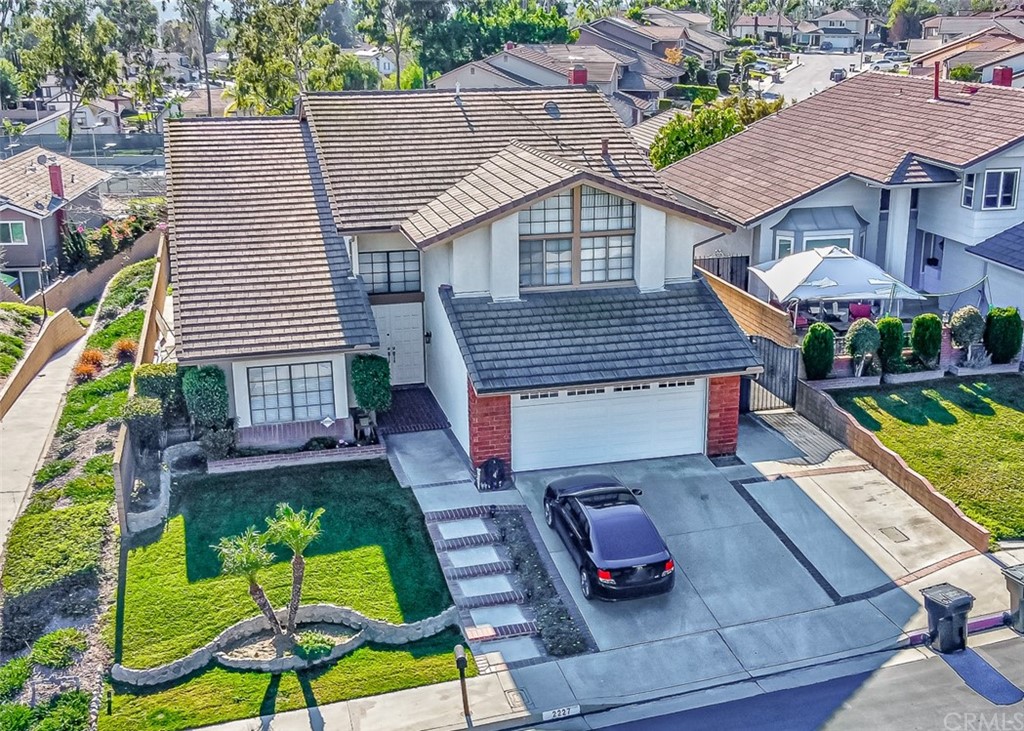 2227 Ardemore Drive Fullerton, CA 92833 - Photo 2 of 7 an aerial view of a house with swimming pool garden and patio