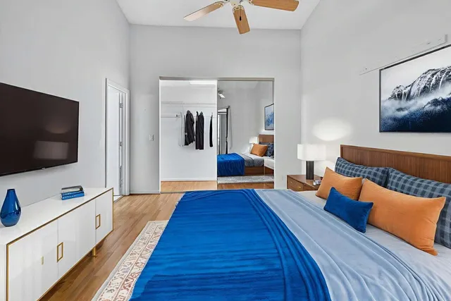 a view of an empty room with wooden floor