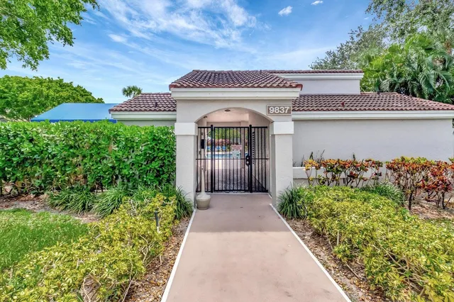 an aerial view of residential houses with outdoor space and street view