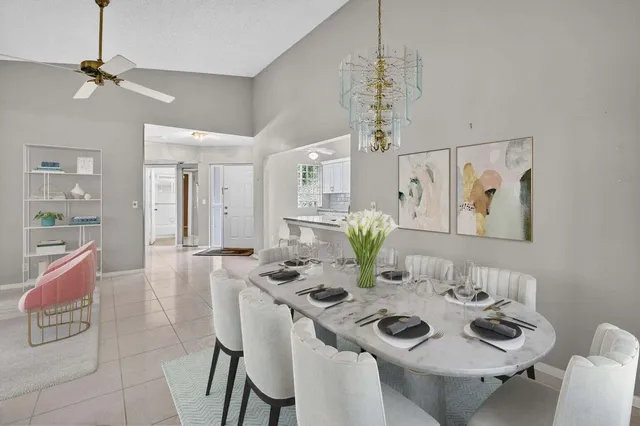 a view of a dining room with furniture and chandelier