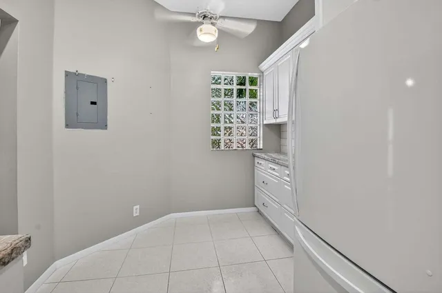 a room with cabinets and a window