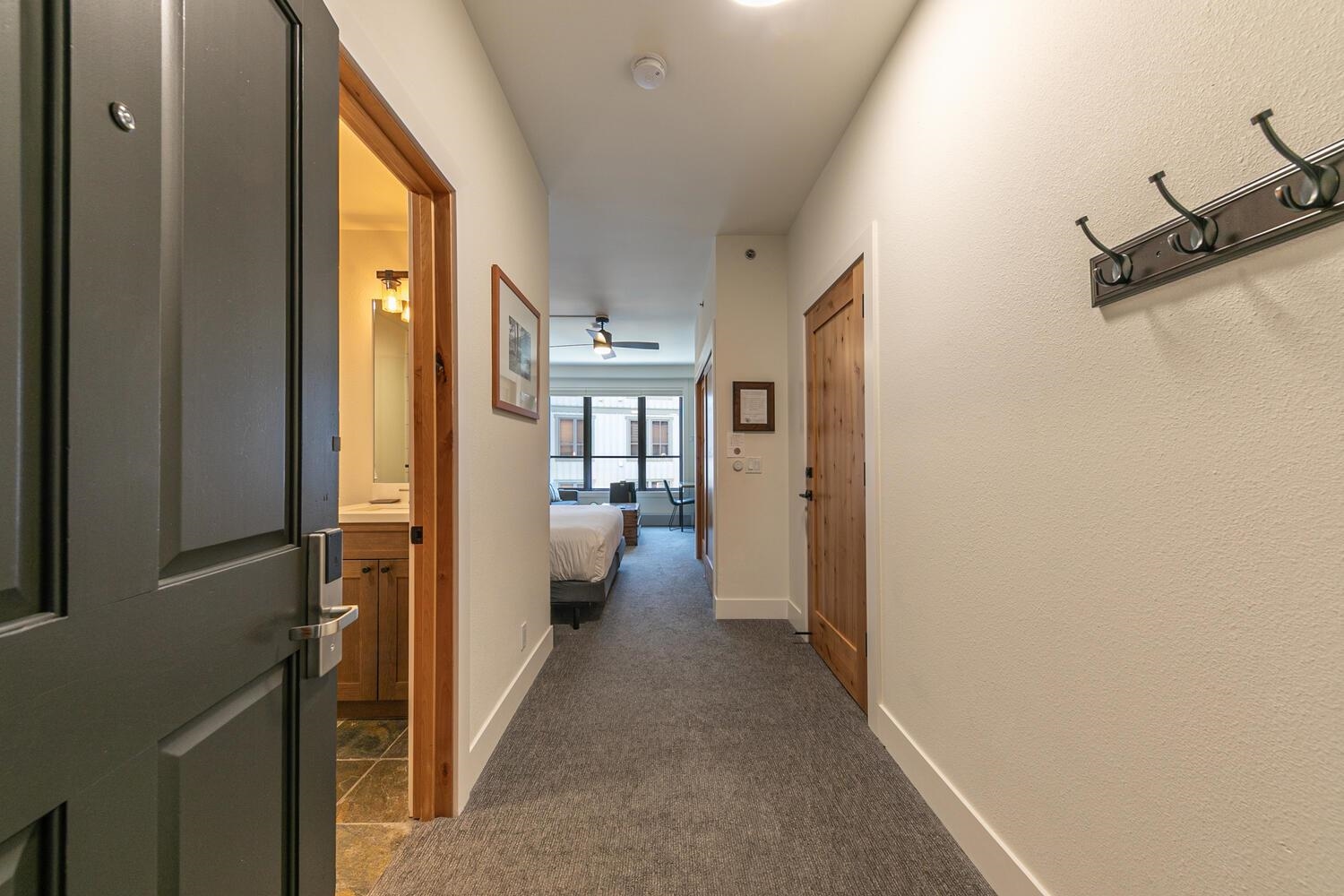 1750 Village East Road, Unit 5314 316 Olympic Valley, CA 96146 - Photo 17 of 28 a view of a hallway with living room and furniture