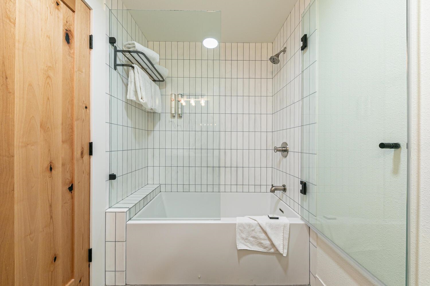 1750 Village East Road, Unit 5314 316 Olympic Valley, CA 96146 - Photo 18 of 28 a bathroom with a bathtub and a shower