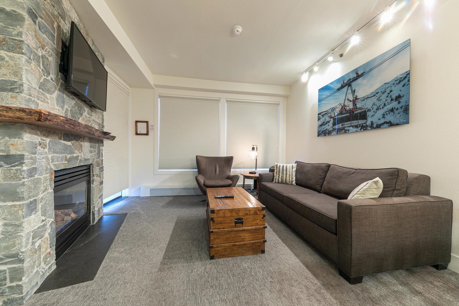 1750 Village East Road, Unit 5314 316 Olympic Valley, CA 96146 - Photo 6 of 28 a living room with furniture and a fireplace