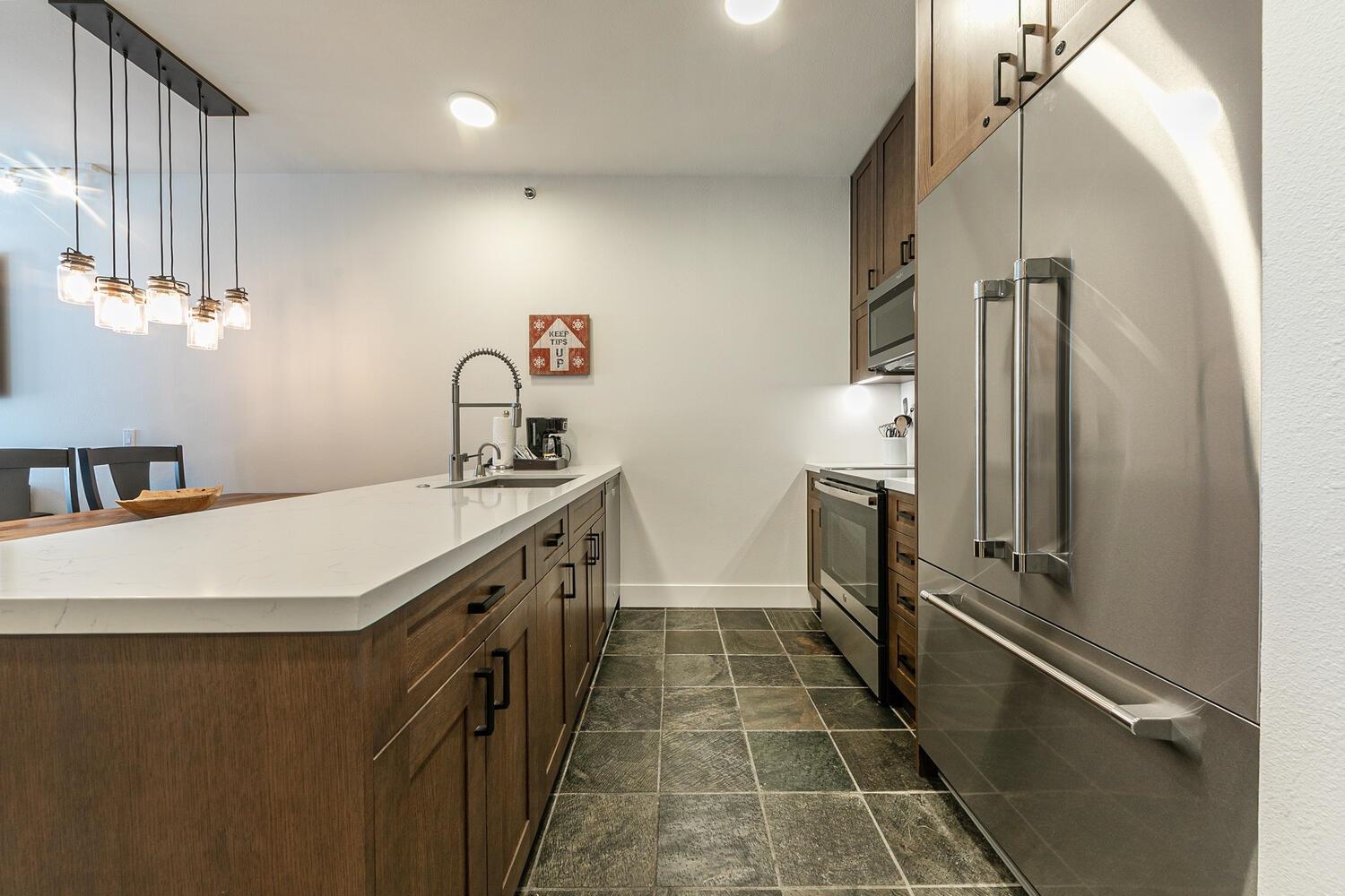 1750 Village East Road, Unit 5314 316 Olympic Valley, CA 96146 - Photo 10 of 28 a kitchen with a sink stove and refrigerator