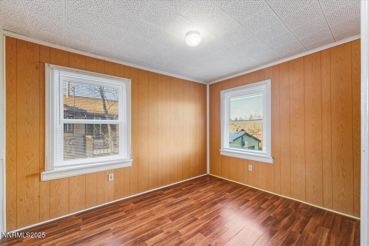 1140 The Strand Reno, NV 89503 - Photo 11 of 19 a view of an empty room with wooden floor and a window