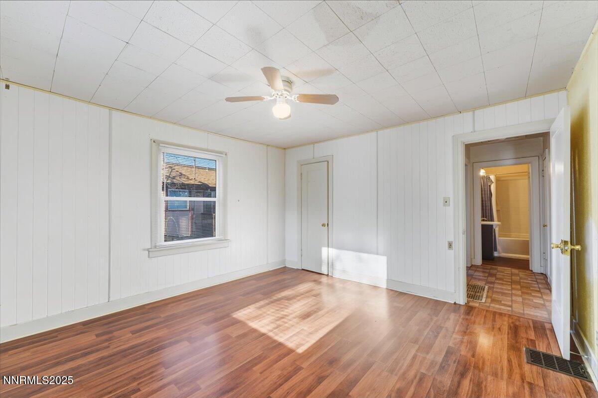 1140 The Strand Reno, NV 89503 - Photo 9 of 19 a view of an empty room with wooden floor and a window