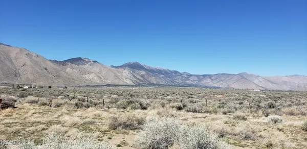 a view of mountain and a mountain in the background