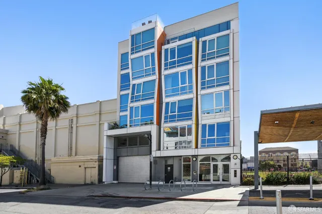 a front view of a building with garden