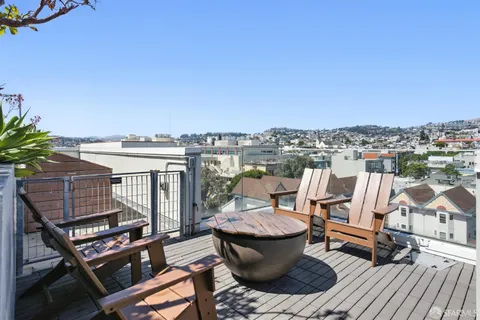 a terrace of a house with outdoor seating