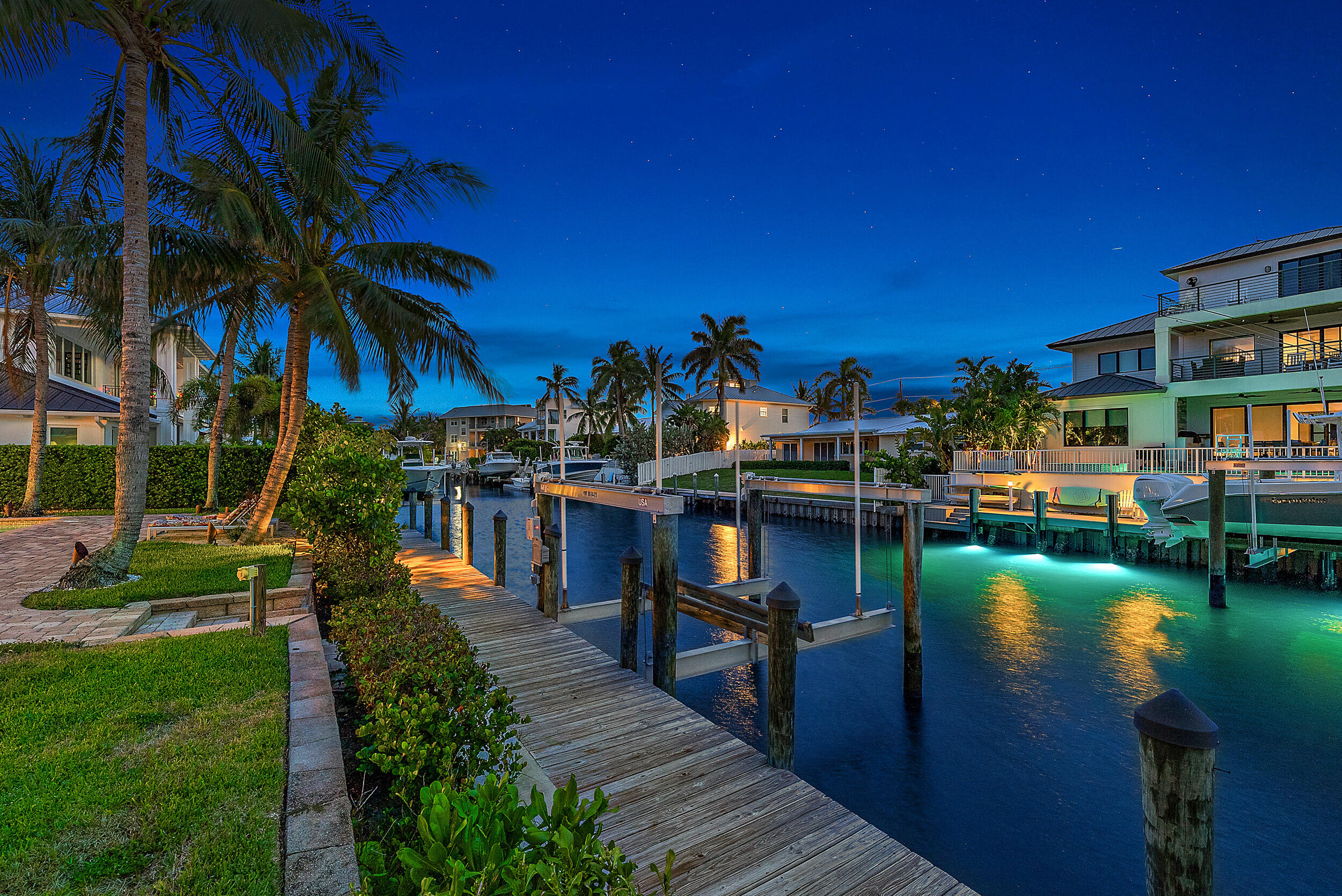 19165 Waterway Road Jupiter, FL 33469 - Photo 8 of 49 Exterior back boat dock/lift Twilight