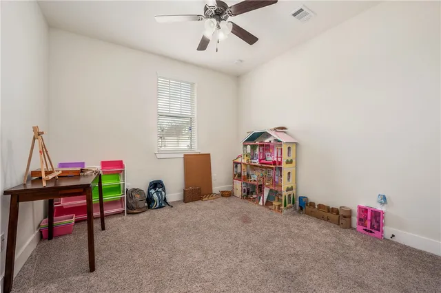 a utility room with cabinets dryer and washer