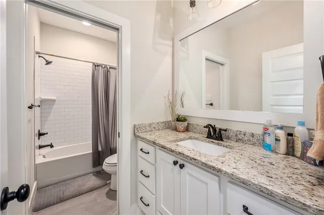 a utility room with sink dryer and washer