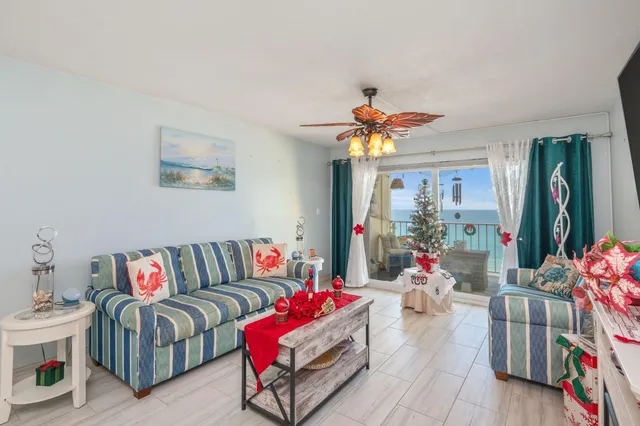 a living room with furniture and flowers