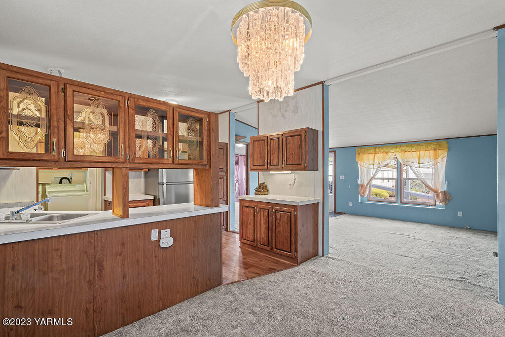 1200 South Euclid Road, Unit 99 Grandview, WA 98930 - Photo 7 of 22 a view of a kitchen with furniture and window