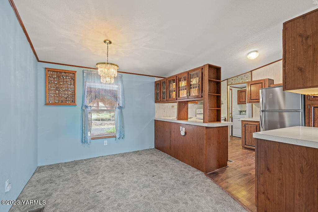 1200 South Euclid Road, Unit 99 Grandview, WA 98930 - Photo 8 of 22 a view of kitchen with furniture and window