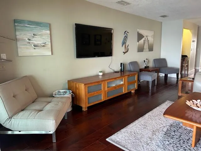 a bedroom with a bed and glass window