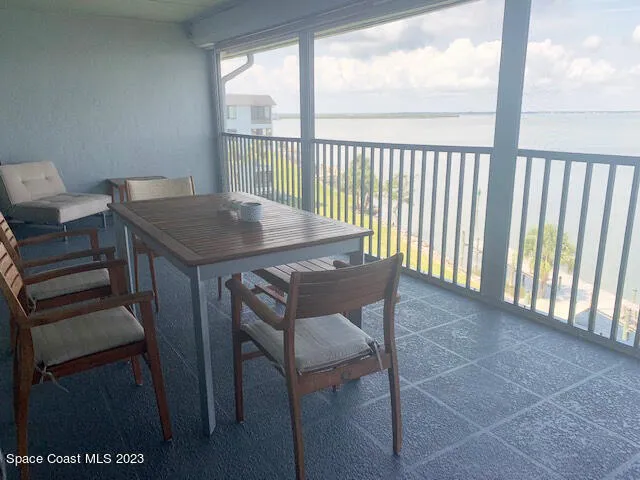 a view of a kitchen with a sink and dishwasher with a fireplace