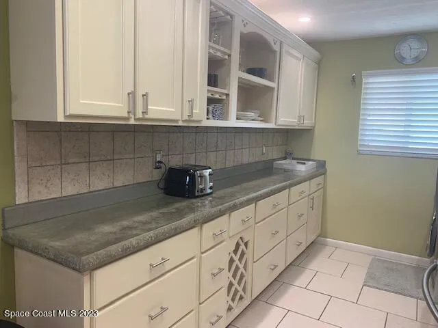 a utility room with sink dryer and washer