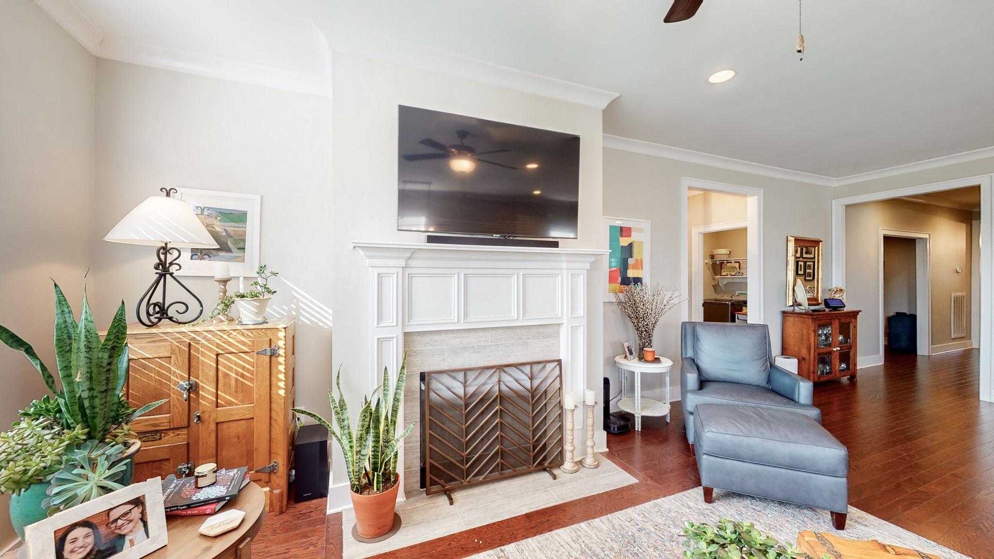 4031 Ryecroft Lane Franklin, TN 37064 - Photo 14 of 51 a living room with furniture a flat screen tv and a fireplace