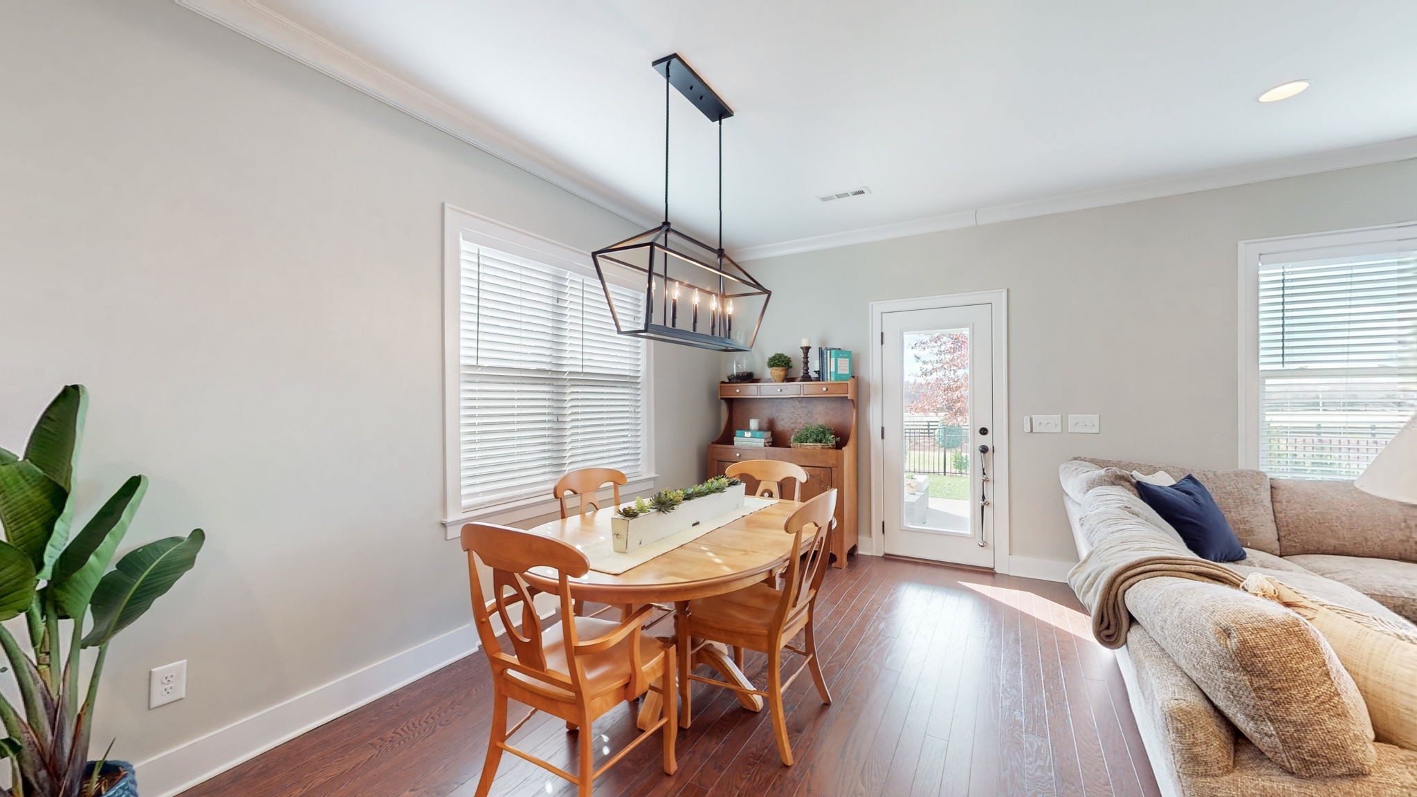 4031 Ryecroft Lane Franklin, TN 37064 - Photo 17 of 51 a dining room with furniture a chandelier and wooden floor