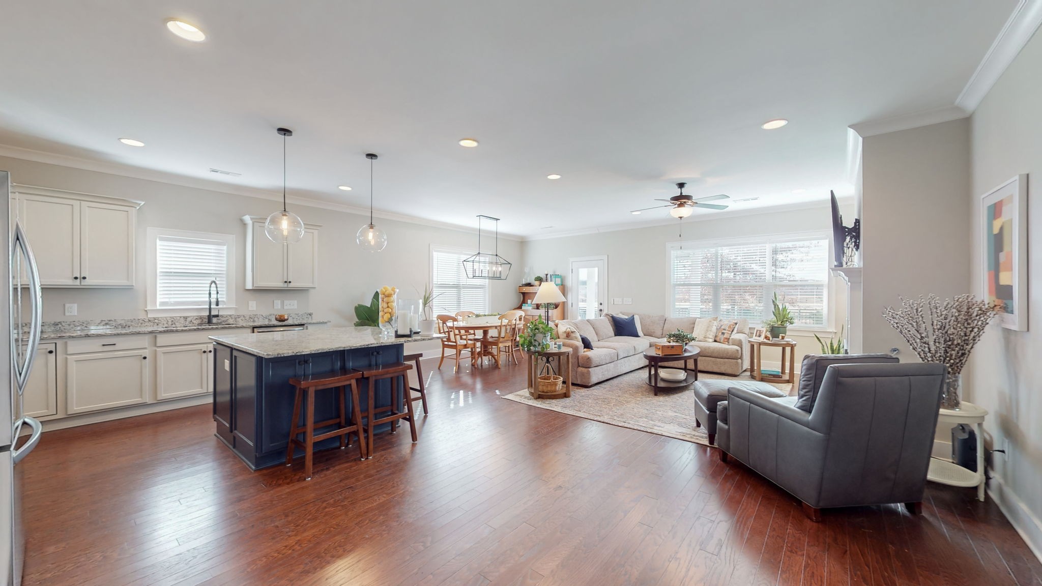 4031 Ryecroft Lane Franklin, TN 37064 - Photo 3 of 51 a open kitchen with stainless steel appliances granite countertop a stove and a living room