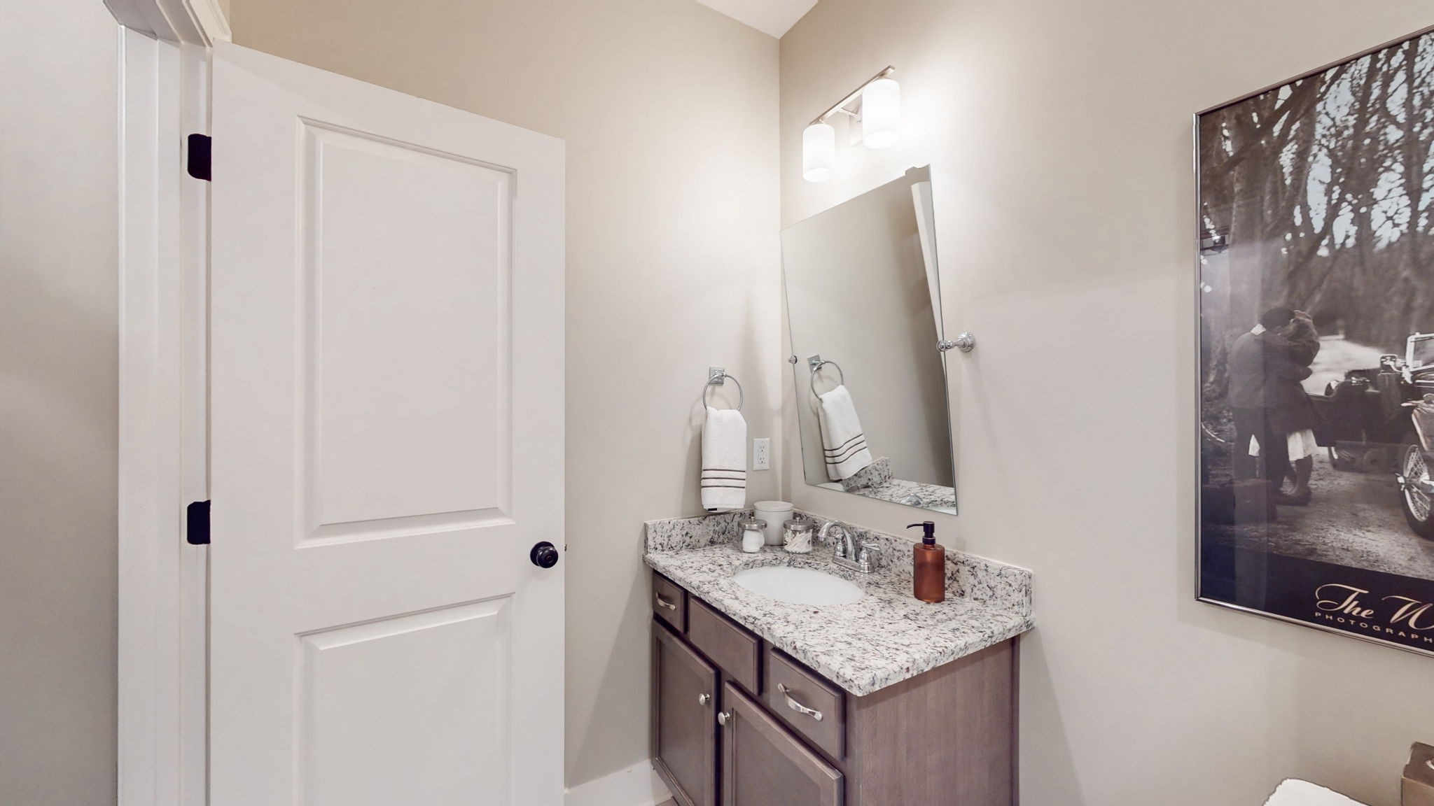 4031 Ryecroft Lane Franklin, TN 37064 - Photo 31 of 51 a bathroom with a granite countertop sink and a mirror