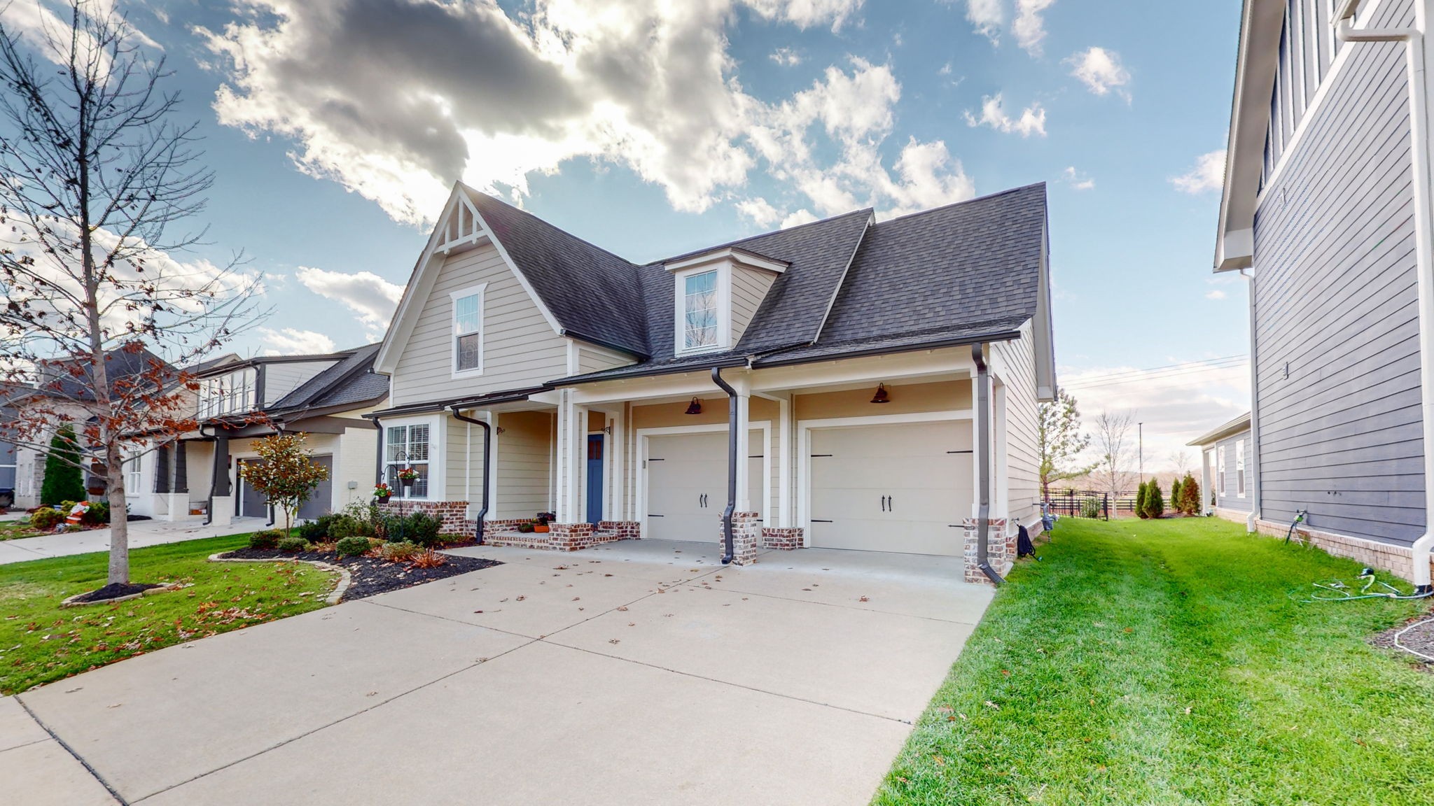 4031 Ryecroft Lane Franklin, TN 37064 - Photo 36 of 51 a view of a white house with a big yard and large tree