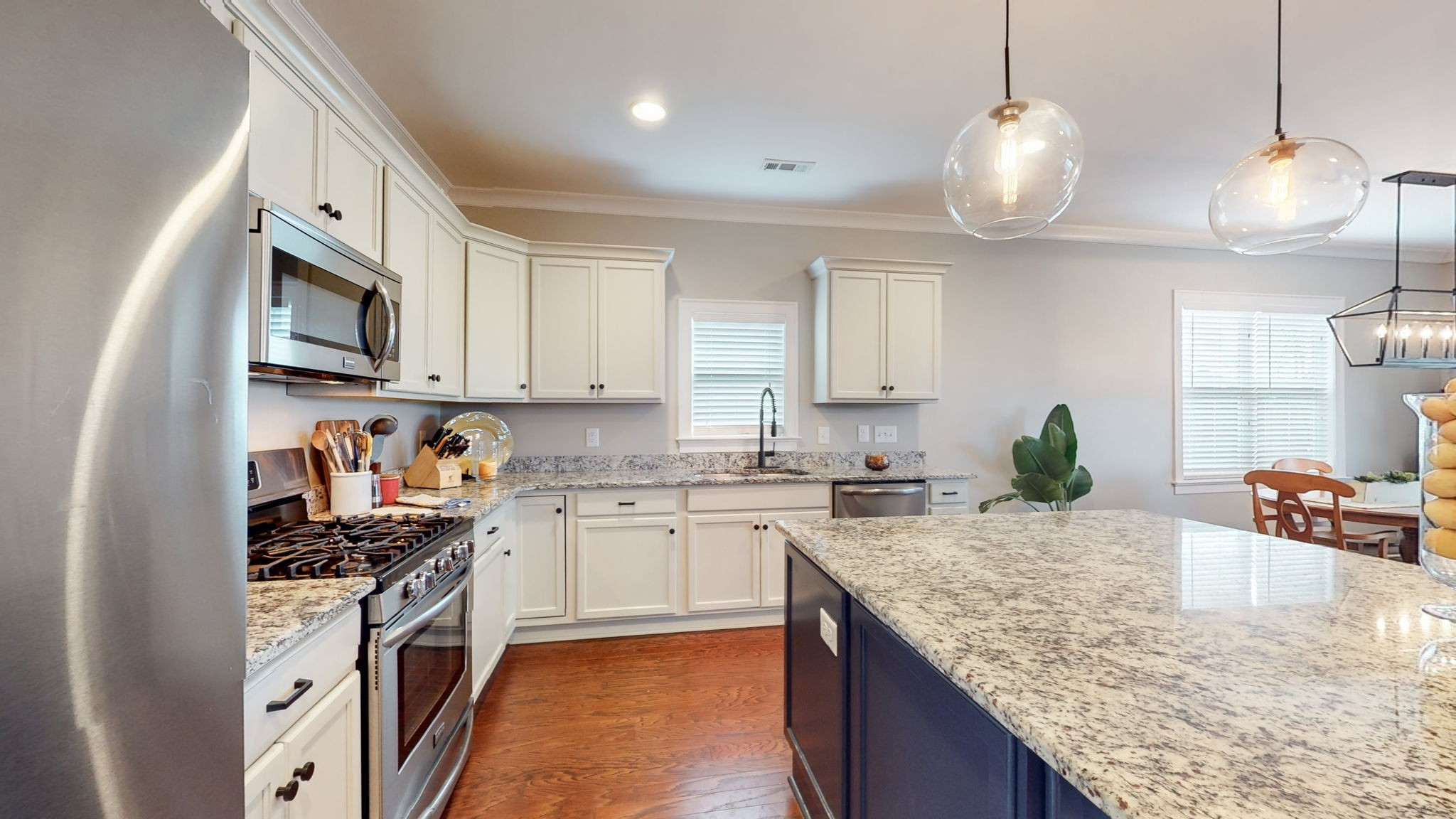 4031 Ryecroft Lane Franklin, TN 37064 - Photo 10 of 51 a kitchen with stainless steel appliances granite countertop a sink stove and refrigerator