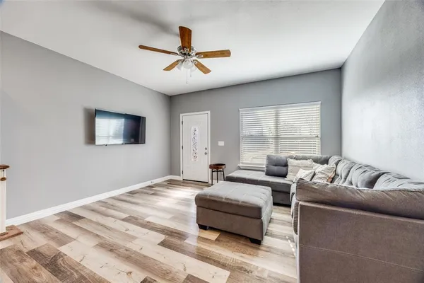 a living room with furniture and a window