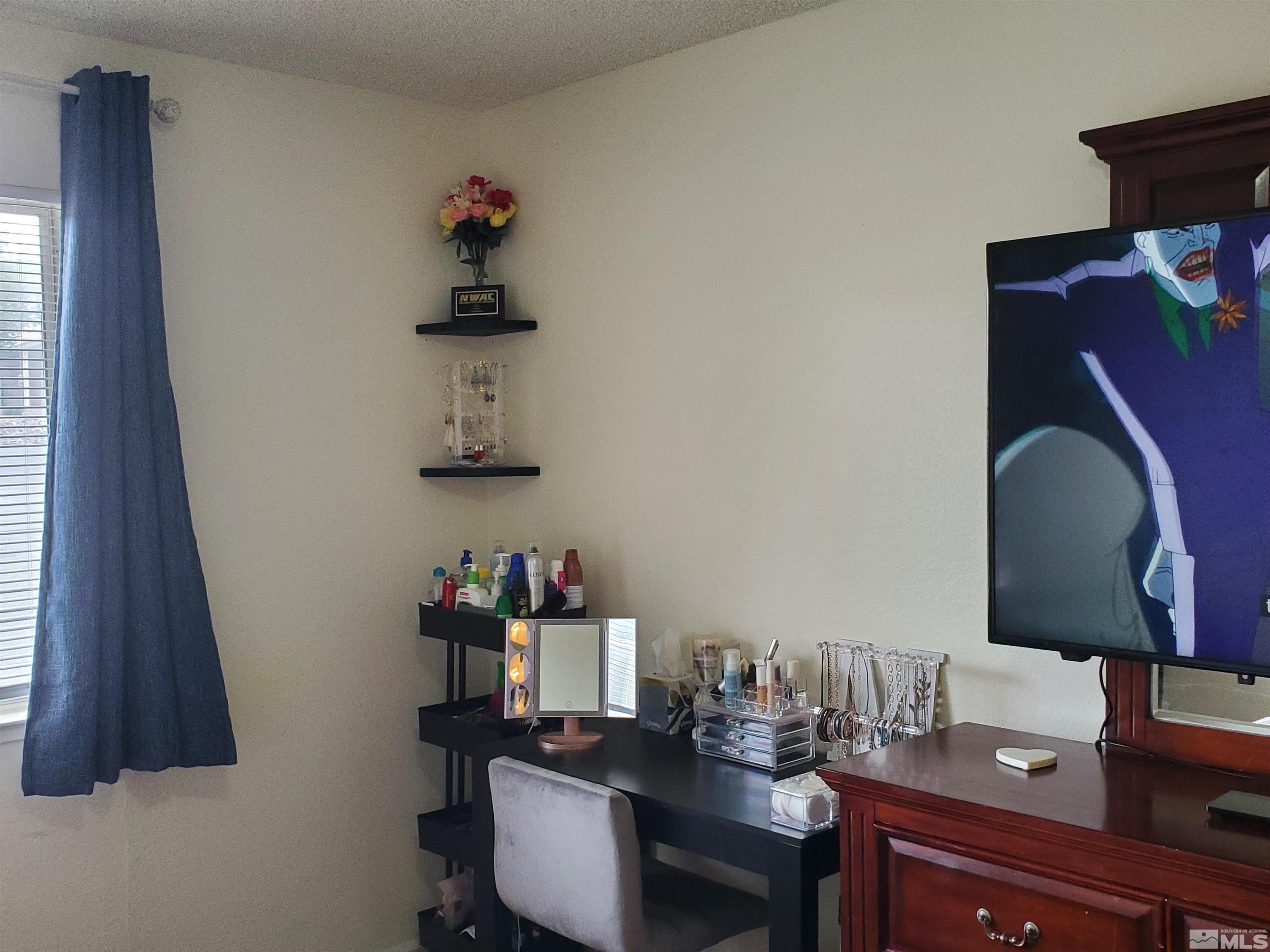 3575 Gypsum Road Reno, NV 89503 - Photo 13 of 32 a room with a table chair and a window