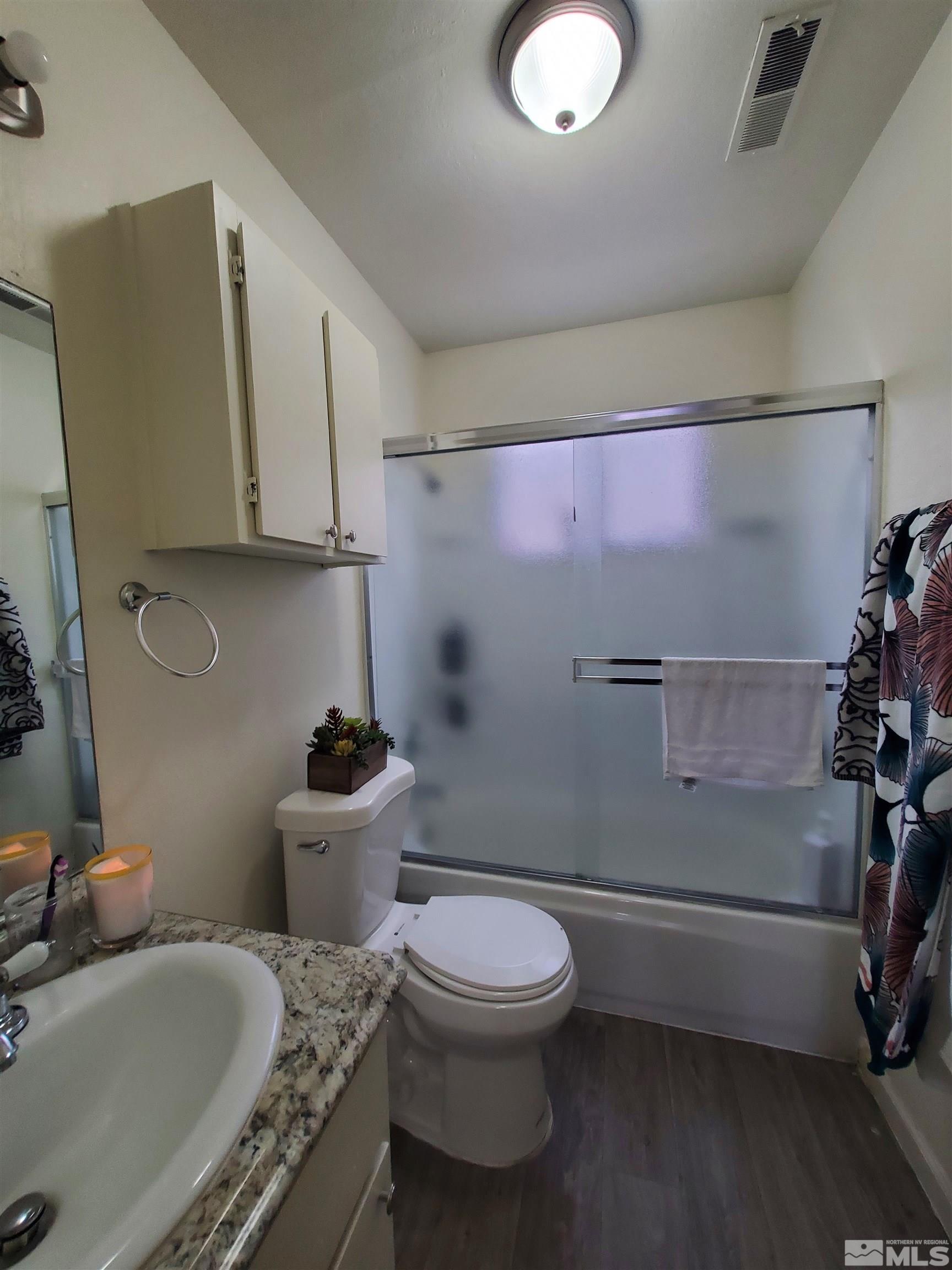 3575 Gypsum Road Reno, NV 89503 - Photo 18 of 32 a bathroom with a sink a toilet and a tub