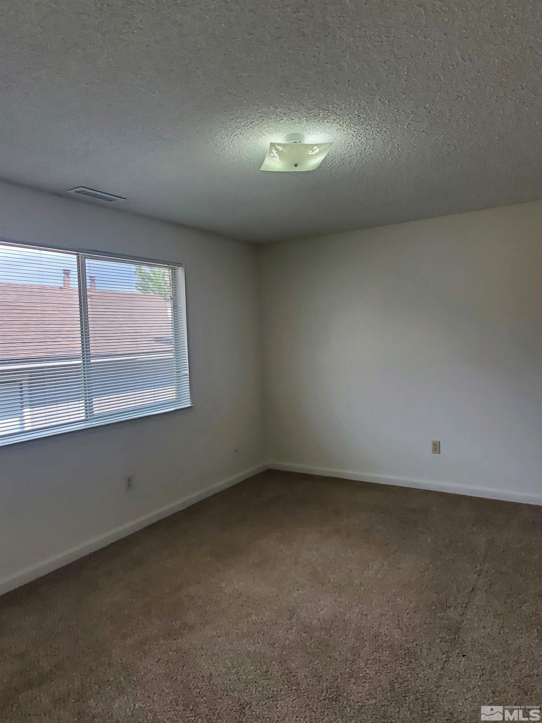 3575 Gypsum Road Reno, NV 89503 - Photo 23 of 32 an empty room with a window
