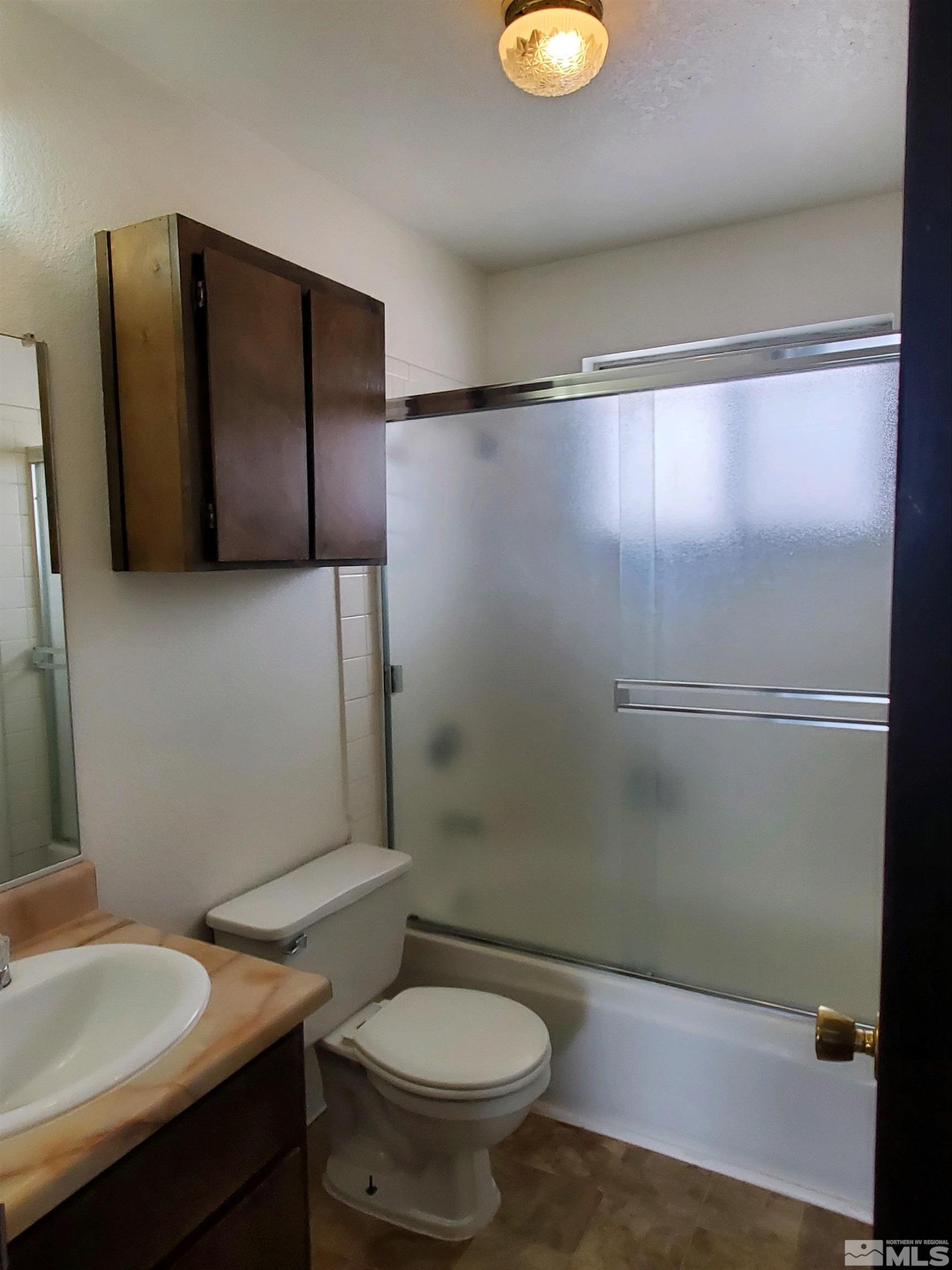 3575 Gypsum Road Reno, NV 89503 - Photo 26 of 32 a bathroom with a sink toilet and shower