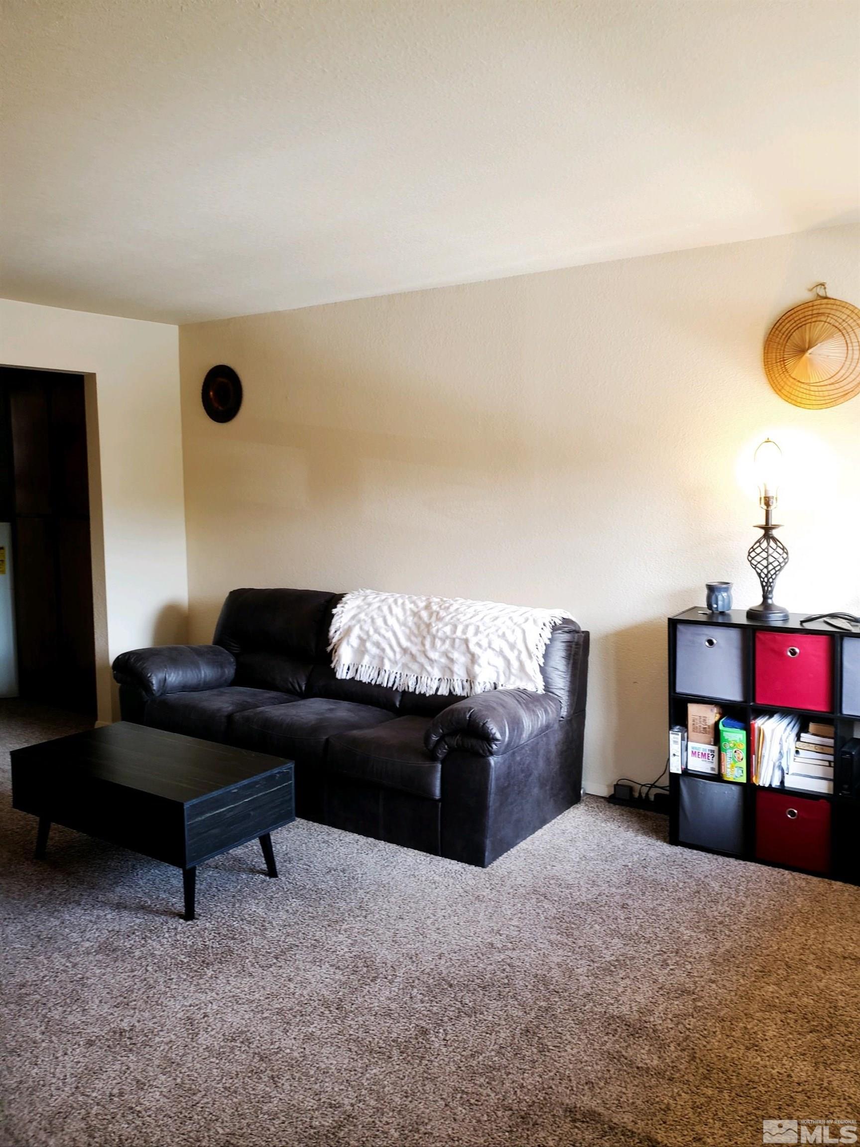3575 Gypsum Road Reno, NV 89503 - Photo 27 of 32 a living room with furniture and a flat screen tv